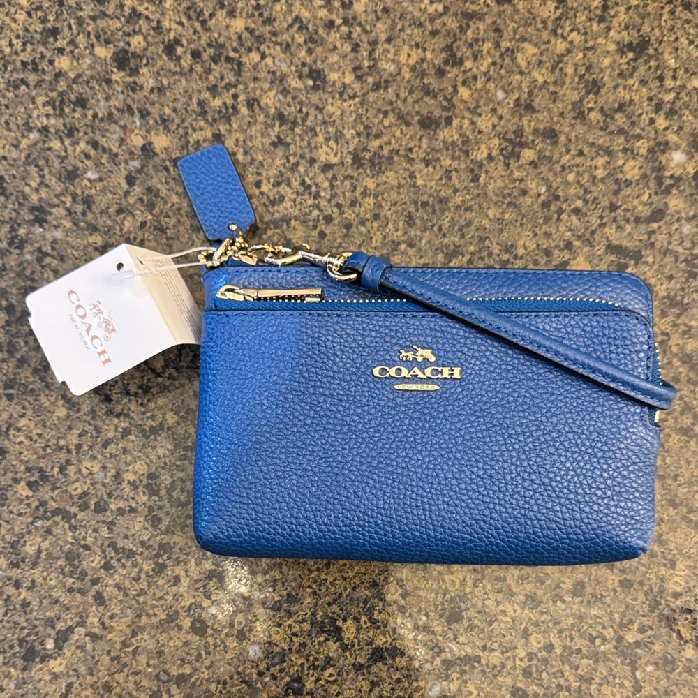 Coach Double Zip Wristlet with 2 credit card slots.Pebbled Leather in denim blue